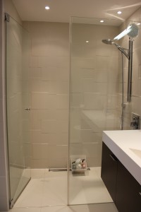 Subtle tiling pattern in master bathroom wet room area