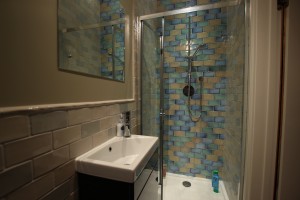 Bathroom with crackle-glazed vintage tiles 1930s style