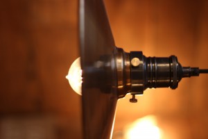 Vintage pendant lighting over banquette seating area