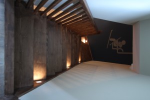 Optical illusion view of going down staircase and seeing ski lift mural