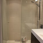 Subtle tiling pattern in master bathroom wet room area