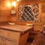 Banquette seating area with ski chalet faux window