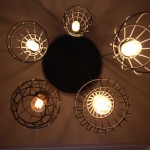 Cage chandelier lighting over pool table